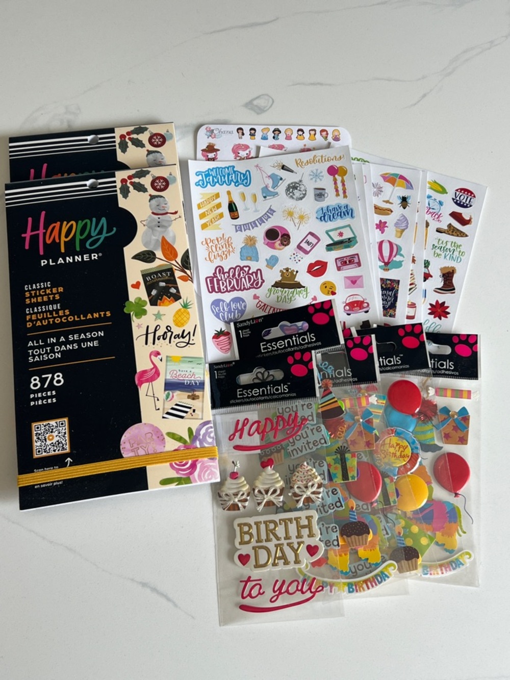 Happy Planner sticker books and various seasonal stickers
